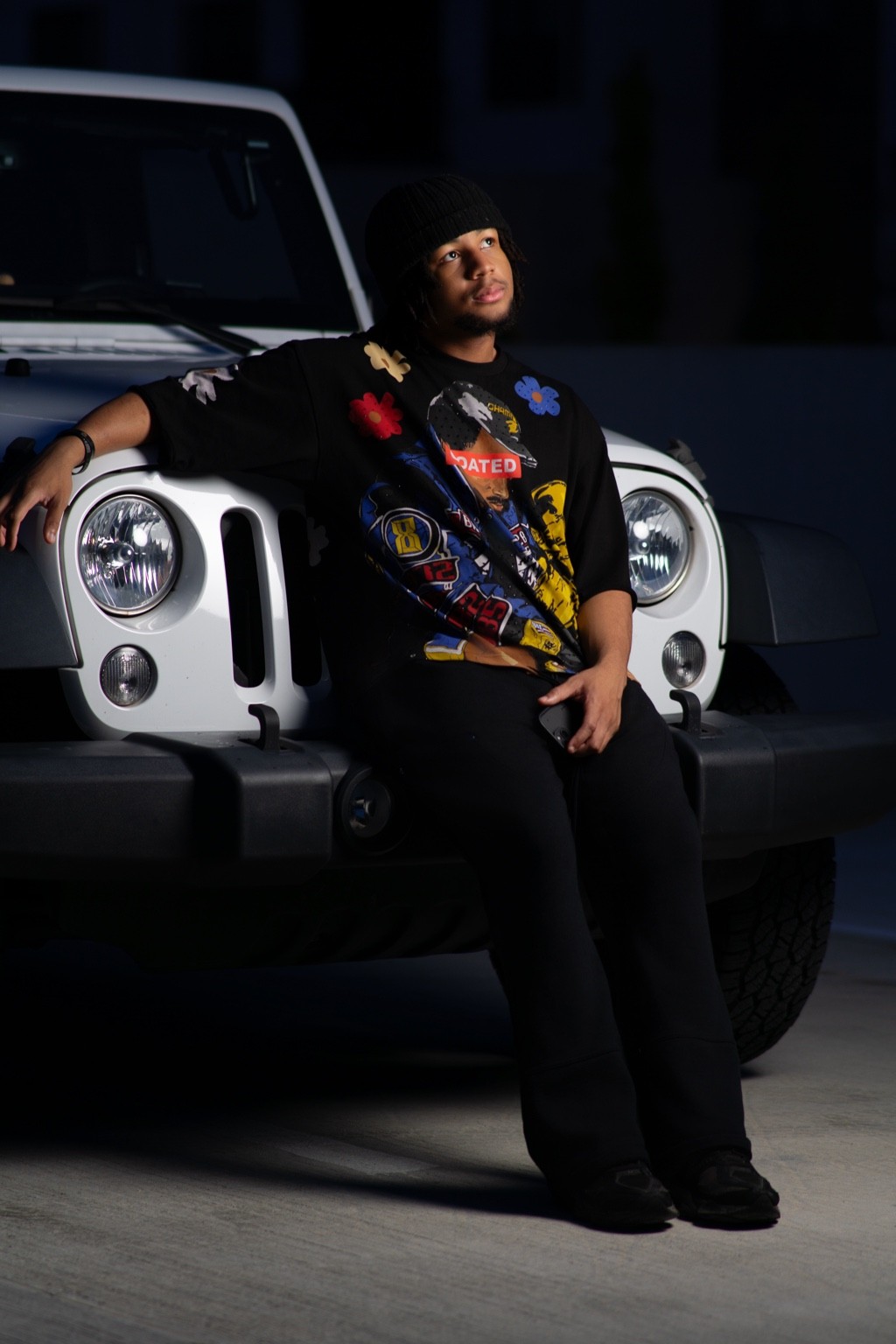 Creative portrait in front of Jeep